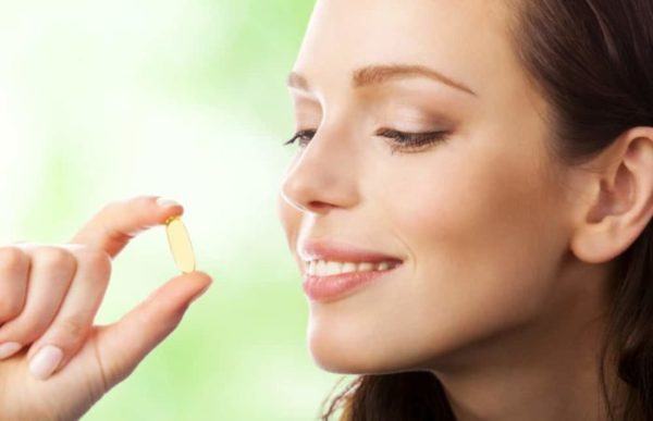 Portrait-Of-Woman-With-Omega-3-Fish-Oil-Capsule